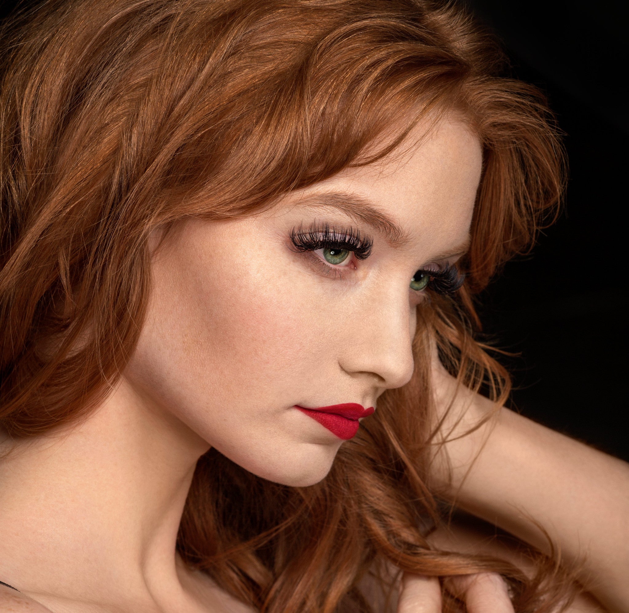 girl posing with eyelash extensions