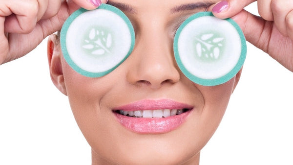 girl with cucumbers on her eyes