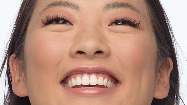 girl smiling with eyelash extensions
