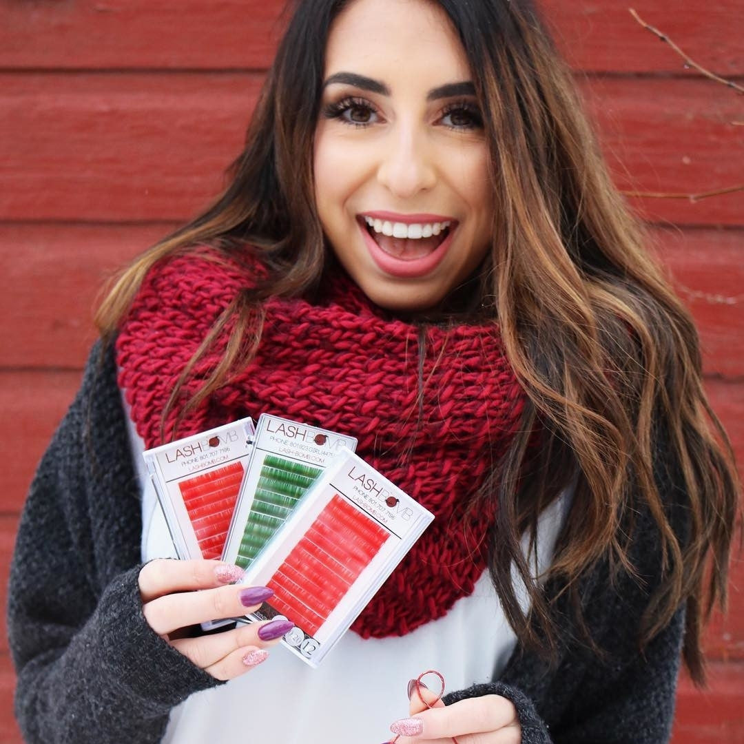 Girl holding eyelash extensions