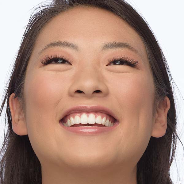 girl smiling with eyelash extensions